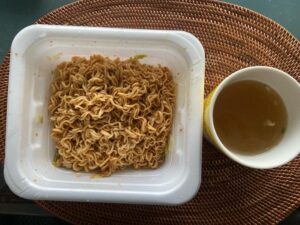 A serving of Yakisoba Bento with soup, showing its ready-to-eat simplicity.